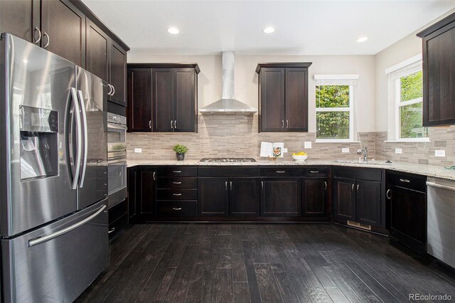 3522 Harvard Pl, Broomfield, CO 80023 - kitchen featuring stainless steel appliances, a sink, wall chimney exhaust hood, and dark wood-type flooring