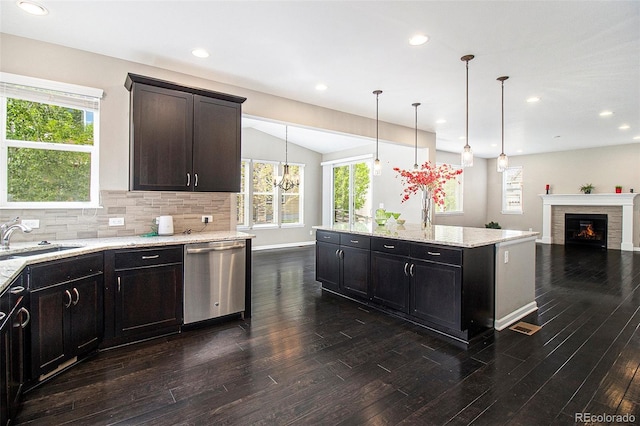 3522 Harvard Pl, Broomfield, CO 80023 - kitchen with a sink, dark wood finished floors, backsplash, open floor plan, and stainless steel dishwasher