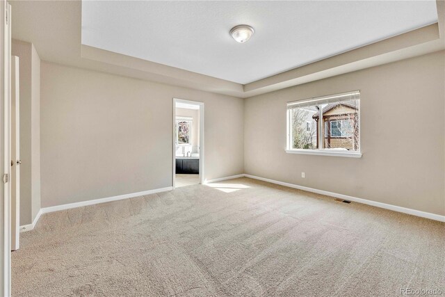 3522 Harvard Pl, Broomfield, CO 80023 - carpeted empty room with visible vents, baseboards, and a tray ceiling