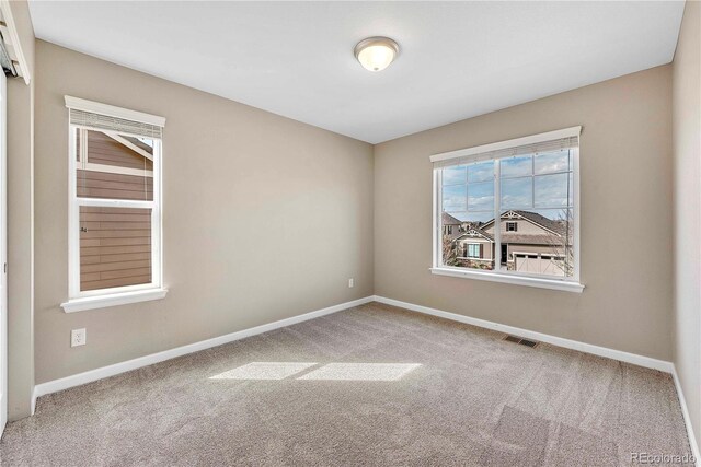 3522 Harvard Pl, Broomfield, CO 80023 - carpeted spare room featuring baseboards and visible vents
