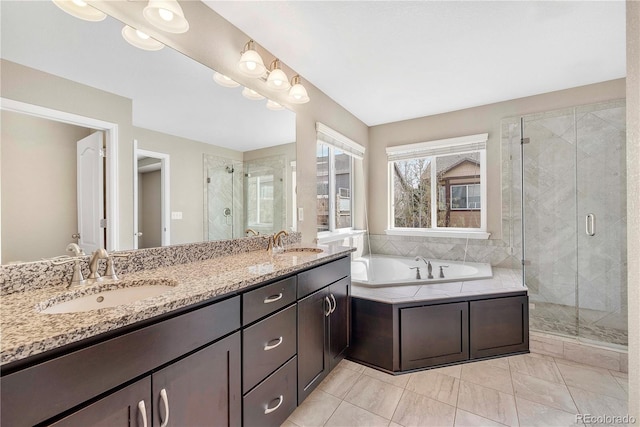 3522 Harvard Pl, Broomfield, CO 80023 - full bath featuring a sink, double vanity, a shower stall, and a bath