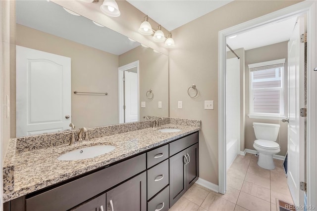 3522 Harvard Pl, Broomfield, CO 80023 - full bath featuring double vanity, a sink, baseboards, and toilet