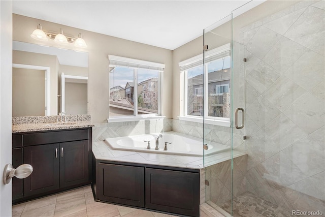 3522 Harvard Pl, Broomfield, CO 80023 - bathroom with vanity, tile patterned flooring, a bath, and a shower stall