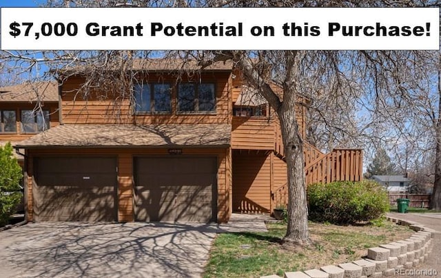 2279 E 129th Ave, Thornton, CO 80241 - view of front of home with a garage, driveway, and a shingled roof