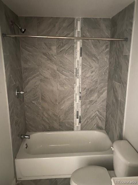 8220 E 104th Way, Henderson, CO 80640 - bathroom with toilet and tub / shower combination
