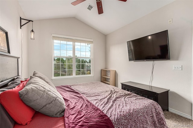 bedroom with vaulted ceiling, ceiling fan, and carpet floors