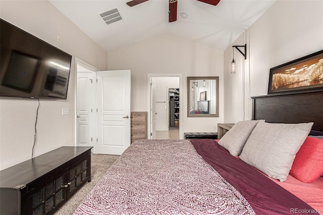 bedroom with vaulted ceiling, ceiling fan, and carpet flooring