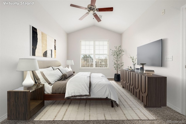 carpeted bedroom with lofted ceiling and ceiling fan