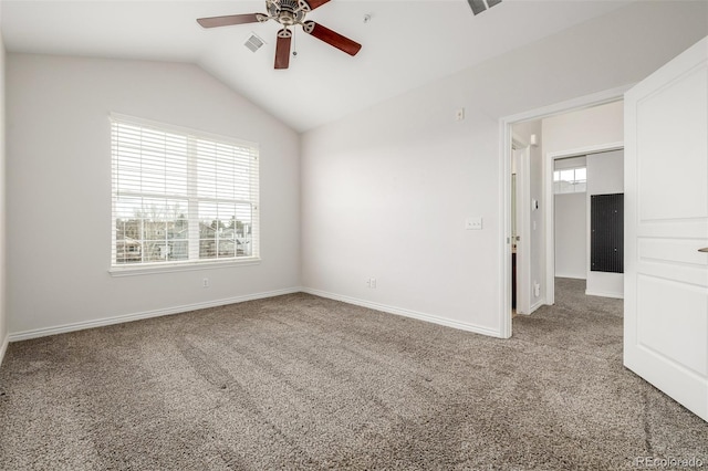 carpeted empty room featuring lofted ceiling and ceiling fan