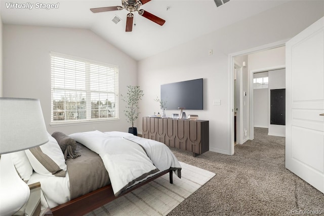 bedroom with ceiling fan, carpet, and lofted ceiling