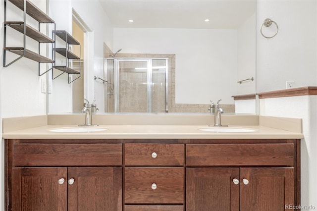 bathroom with vanity and an enclosed shower