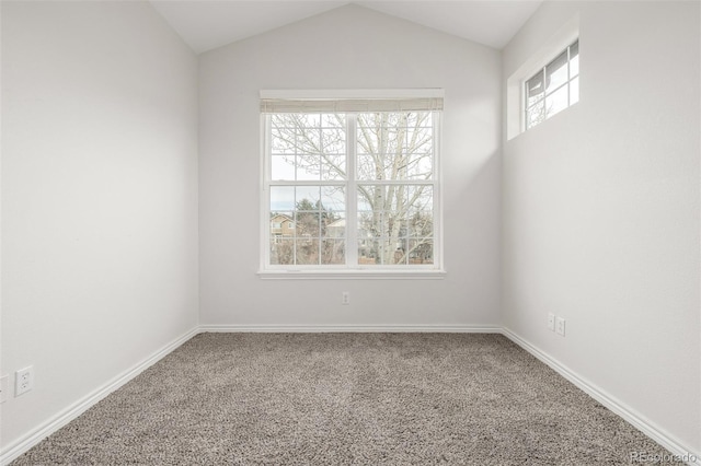 unfurnished room featuring vaulted ceiling and carpet floors