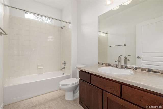 full bathroom featuring tile patterned floors, vanity, toilet, and tiled shower / bath