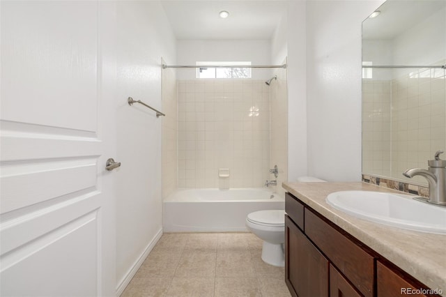 full bathroom featuring tile patterned floors, toilet, vanity, and tiled shower / bath