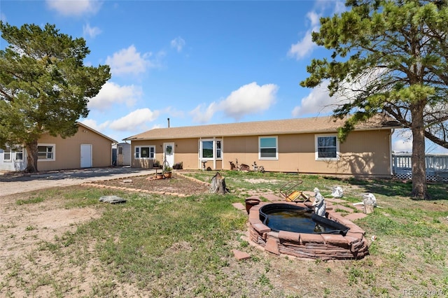 rear view of house with a lawn