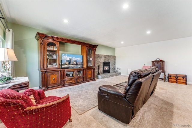 carpeted living room with a fireplace, baseboards, and recessed lighting