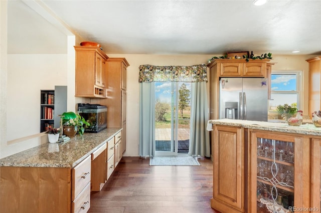 kitchen with beverage cooler, stainless steel fridge with ice dispenser, dark wood finished floors, a peninsula, and light stone countertops