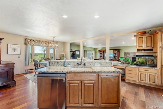kitchen featuring a baseboard heating unit, dishwasher, dark wood-style flooring, and a sink