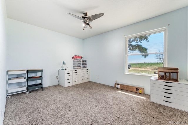 carpeted bedroom featuring a ceiling fan