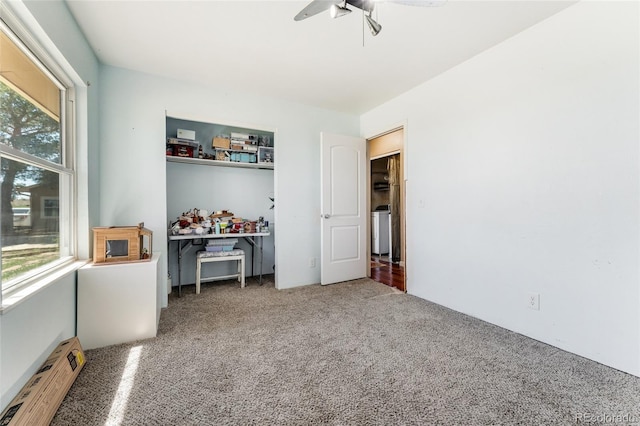 bedroom featuring a baseboard heating unit and carpet