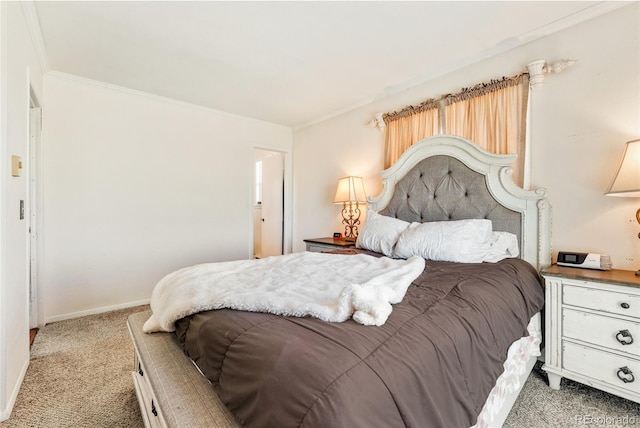 bedroom featuring baseboards, ornamental molding, and carpet flooring