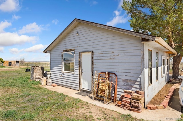 rear view of house with a lawn