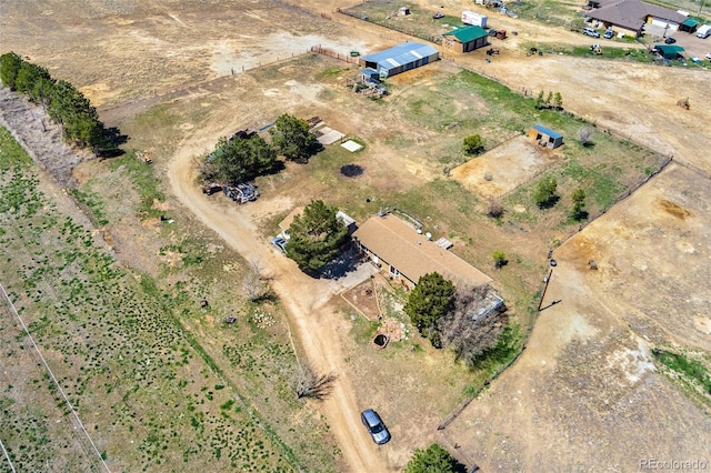 birds eye view of property with a rural view