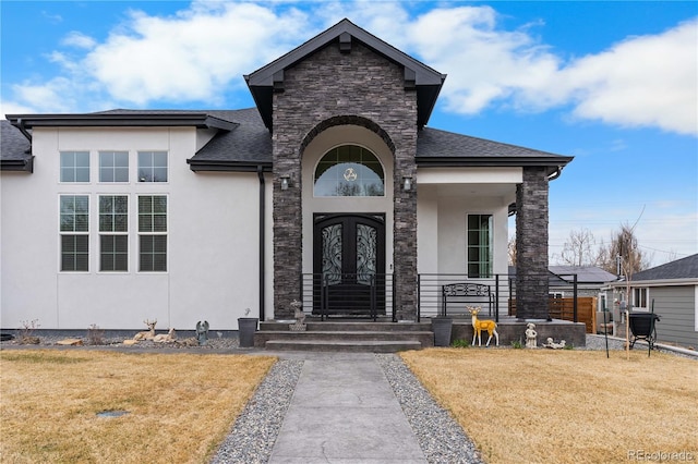 12215 Viewpoint Dr, Lakewood, CO 80401 - doorway to property featuring a lawn, french doors, stone siding, and stucco siding