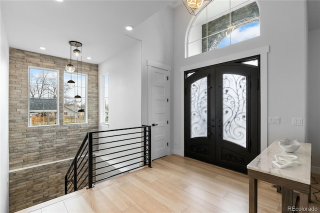 12215 Viewpoint Dr, Lakewood, CO 80401 - foyer entrance with wood finished floors, plenty of natural light, french doors, and recessed lighting