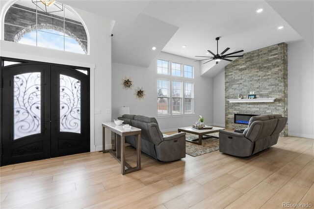 12215 Viewpoint Dr, Lakewood, CO 80401 - entrance foyer with a ceiling fan, french doors, a high ceiling, light wood finished floors, and baseboards