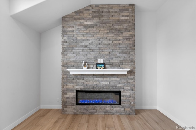 12215 Viewpoint Dr, Lakewood, CO 80401 - interior details featuring baseboards, wood finished floors, and a fireplace
