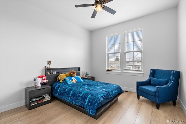 12215 Viewpoint Dr, Lakewood, CO 80401 - bedroom with a ceiling fan, wood finished floors, and baseboards