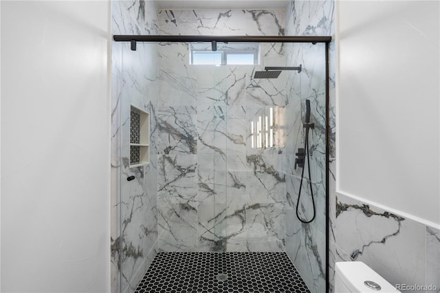 12215 Viewpoint Dr, Lakewood, CO 80401 - bathroom with tile walls, toilet, and a marble finish shower