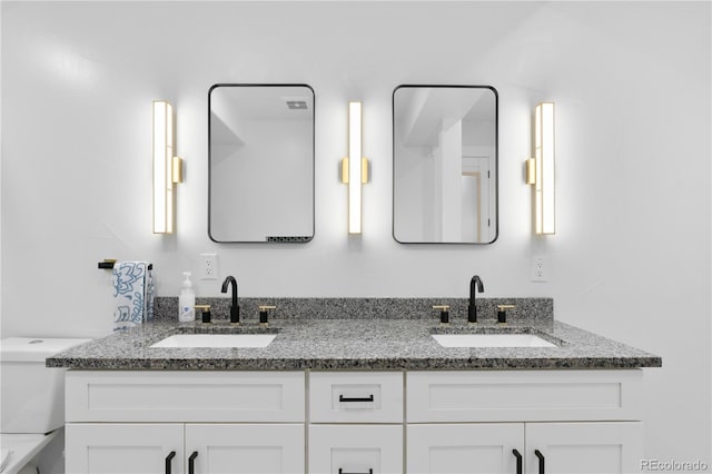 12215 Viewpoint Dr, Lakewood, CO 80401 - full bath featuring double vanity, toilet, and a sink