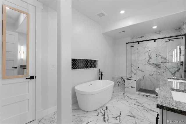 12215 Viewpoint Dr, Lakewood, CO 80401 - bathroom featuring visible vents, marble finish floor, a marble finish shower, a soaking tub, and vanity