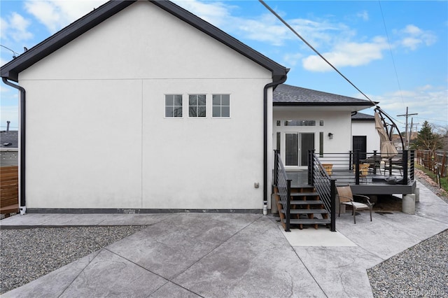 12215 Viewpoint Dr, Lakewood, CO 80401 - back of house with a patio area, stucco siding, a wooden deck, and fence