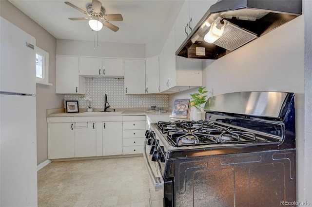 2601 Cooper Ave, Colorado Springs, CO 80907 - kitchen featuring range with gas cooktop, freestanding refrigerator, a sink, exhaust hood, and a ceiling fan