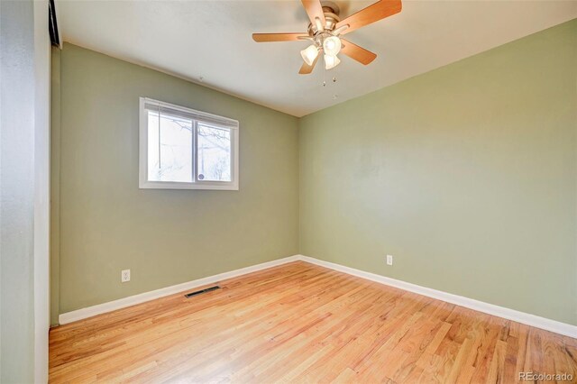 2601 Cooper Ave, Colorado Springs, CO 80907 - unfurnished room with baseboards, wood finished floors, and ceiling fan
