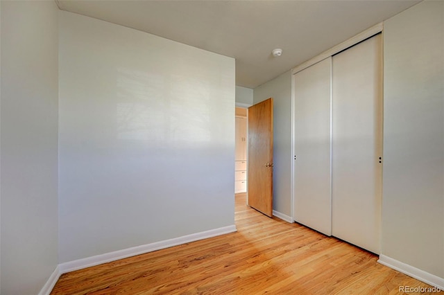 2601 Cooper Ave, Colorado Springs, CO 80907 - unfurnished bedroom with light wood-type flooring, a closet, and baseboards