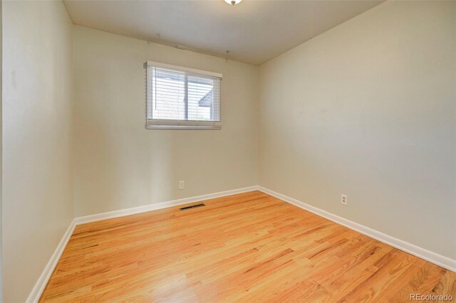 2601 Cooper Ave, Colorado Springs, CO 80907 - empty room with wood finished floors and baseboards