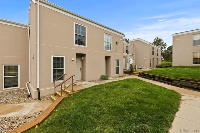 3110 Van Teylingen Dr Unit C, Colorado Springs, CO 80917 - view of front of house with a front lawn and stucco siding