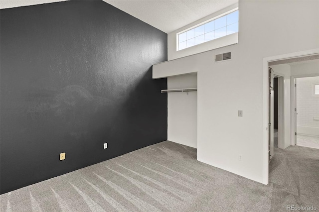 3110 Van Teylingen Dr Unit C, Colorado Springs, CO 80917 - unfurnished bedroom featuring carpet flooring, a closet, and high vaulted ceiling