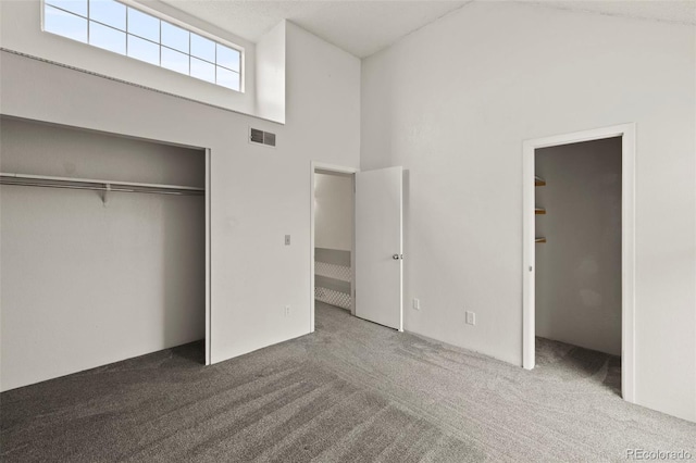 3110 Van Teylingen Dr Unit C, Colorado Springs, CO 80917 - unfurnished bedroom with carpet, a closet, and a towering ceiling
