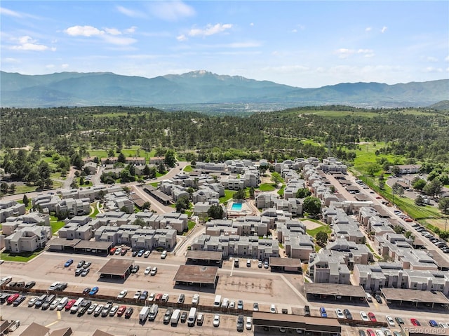 3110 Van Teylingen Dr Unit C, Colorado Springs, CO 80917 - aerial view of residential area featuring a mountainous background and a heavily wooded area
