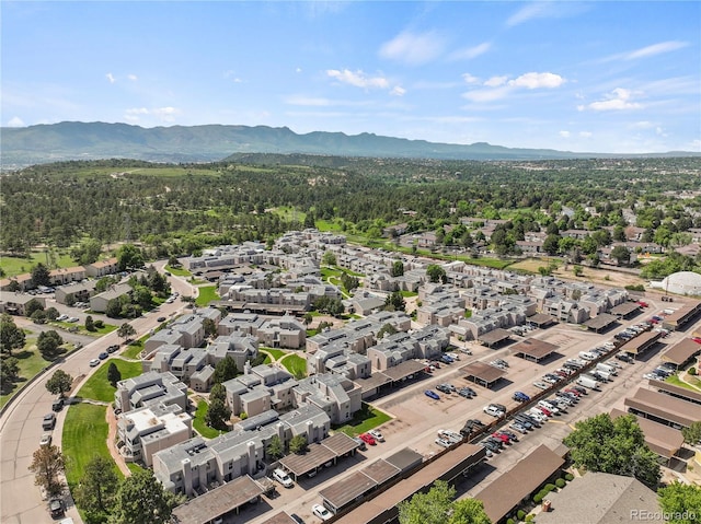 3110 Van Teylingen Dr Unit C, Colorado Springs, CO 80917 - aerial perspective of suburban area featuring a mountainous background and a forest