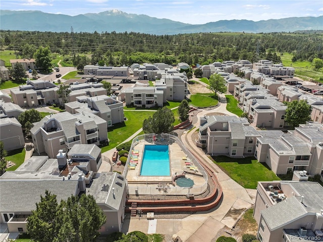 3110 Van Teylingen Dr Unit C, Colorado Springs, CO 80917 - aerial perspective of suburban area with a forest, mountains, and a pool area