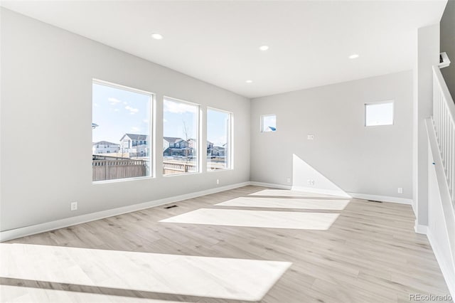 unfurnished room featuring light hardwood / wood-style floors