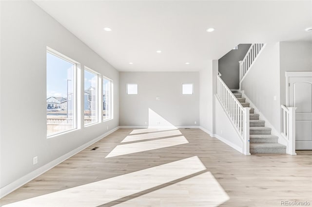 spare room with light hardwood / wood-style flooring