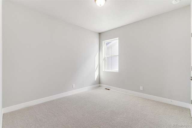 unfurnished room featuring carpet