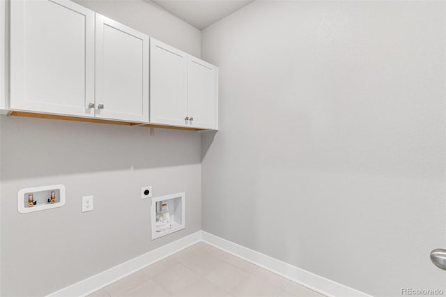 laundry room with hookup for an electric dryer, hookup for a washing machine, and cabinets